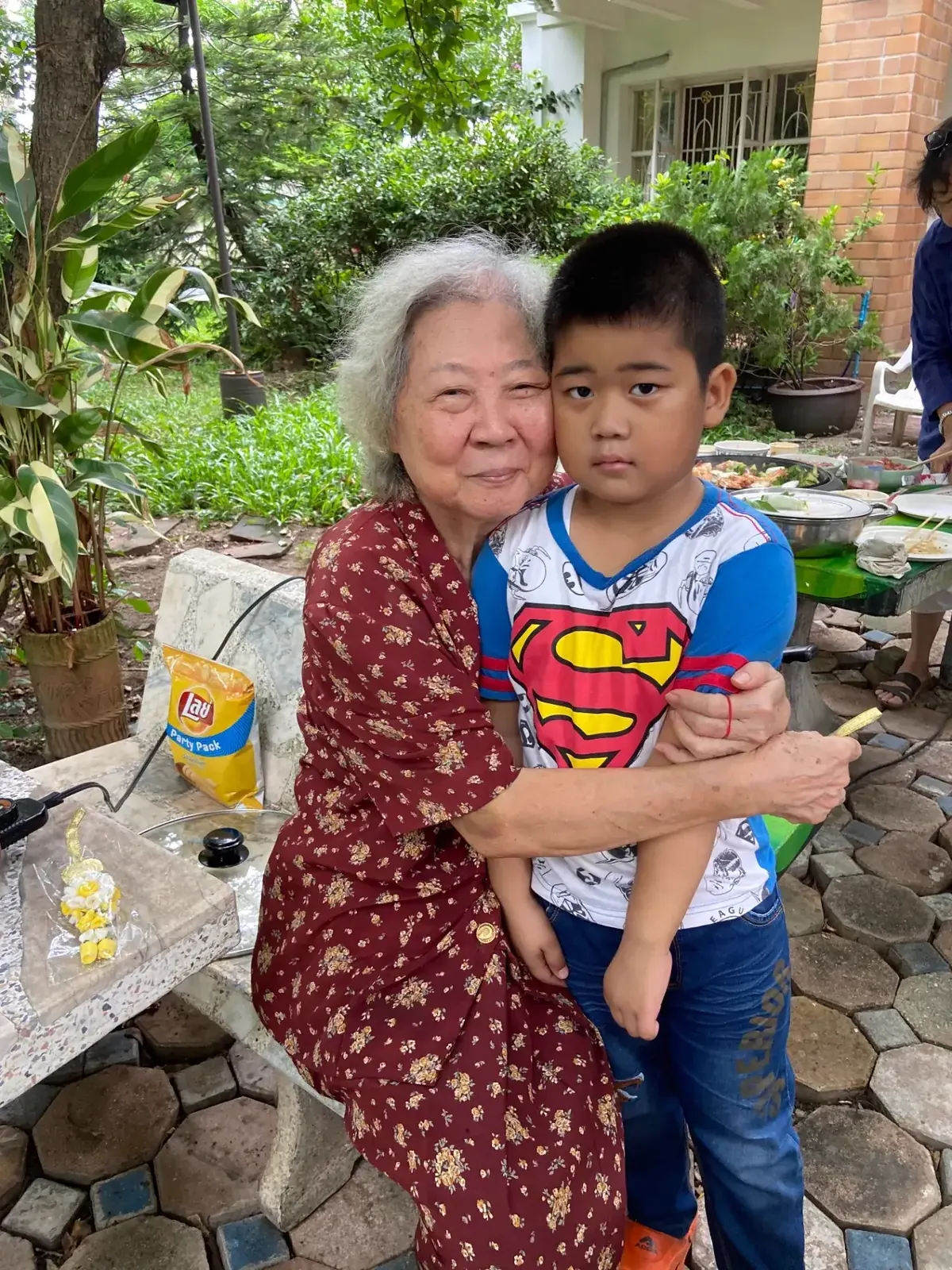 Grandmother hugging a young child