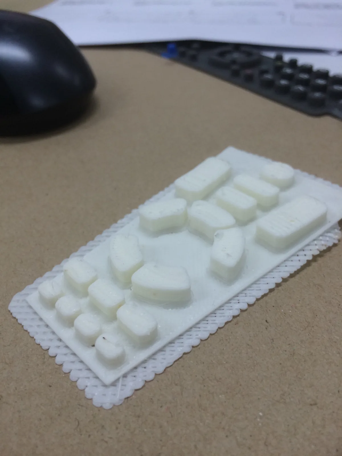 3D-printed button set on a printed raft